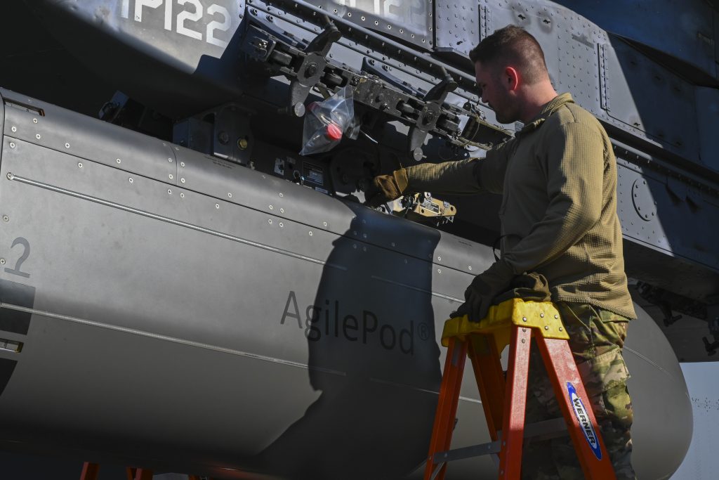 TSgt Andrew Groff, 307th Aircraft Maintenance Squadron aircraft armament technician, adjusts an AgilePod onto a B-52 Stratofortress, at Barksdale Air Force Base, Louisiana, Jan. 10, 2023. The AgilePod is a multi-function pod built to integrate advanced communications capabilities for the B-52 across all domains. (U.S. Air Force photo by Airman 1st Class Nia Jacobs)